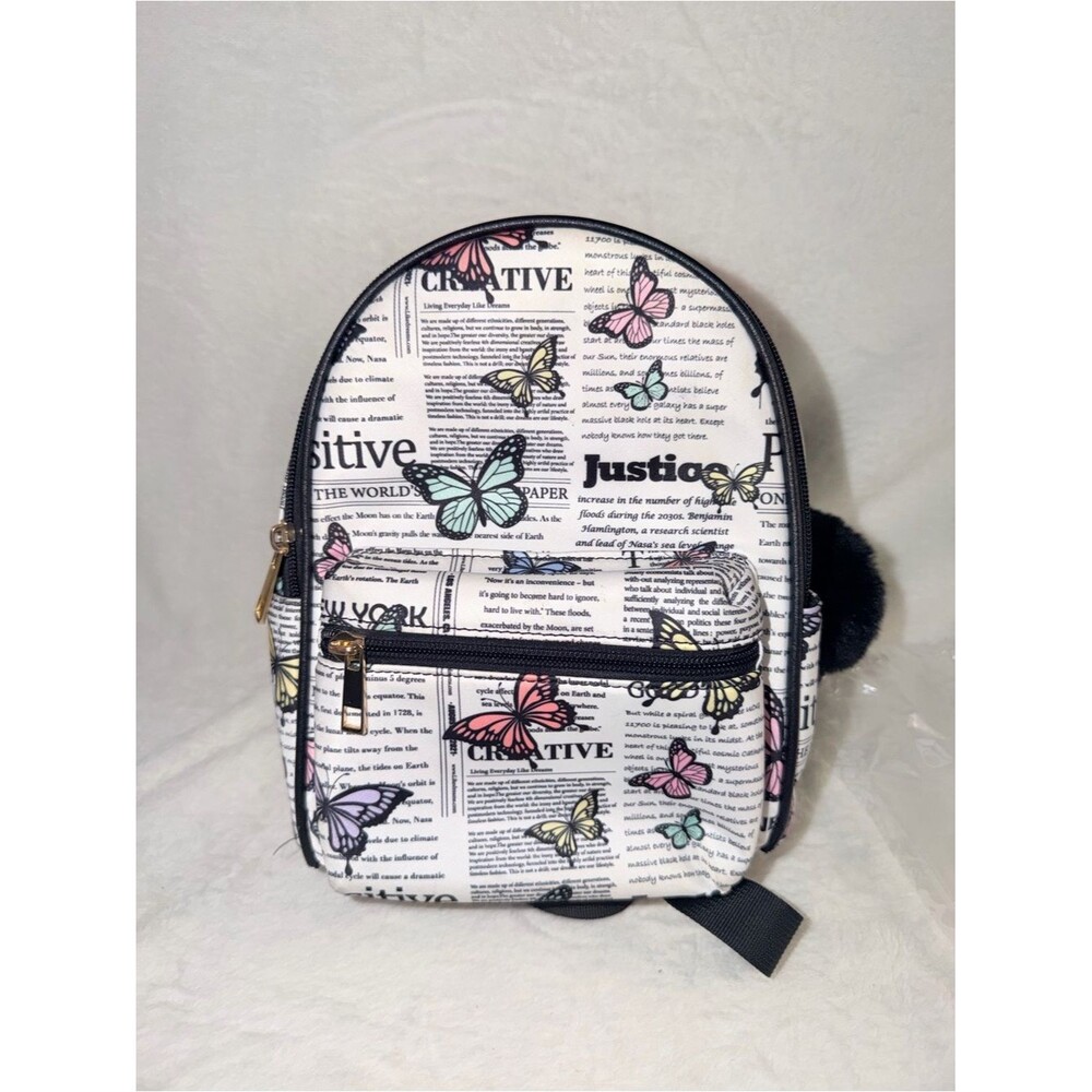 Like Dreams Butterfly Newspaper Mini Backpack Womens OS White Multicolor Pom Pom